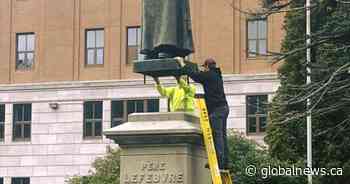 Century-old statue returned to its base in Memramcook, N.B. after vandalism