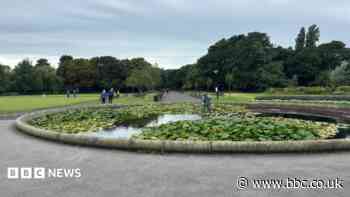 Woman found dead in park pond