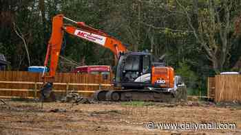 Travellers are ordered to leave illegal site opposite Britain's nuclear weapons factory where they built 13 static homes
