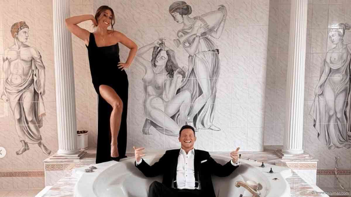 Stacey Solomon poses alongside her nude murals while husband Joe Swash relaxes in the bath as the pair get NTA ready from their new huge bathroom in hilarious snaps