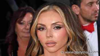 Jesy Nelson shows her ex Zion Foster what he's missing in a sexy black gown with matching leather gloves as she attends the NTAs after his new romance was revealed