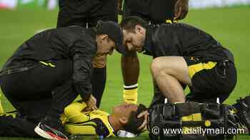 Borussia Dortmund star rushed to hospital after slumping to the pitch with 'circulatory problems' during Champions League tie