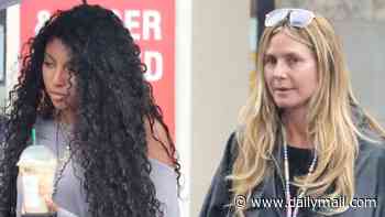 Heidi Klum's daughter Lou, 16, is the SAME height as her as the duo brave the rain in Los Angeles