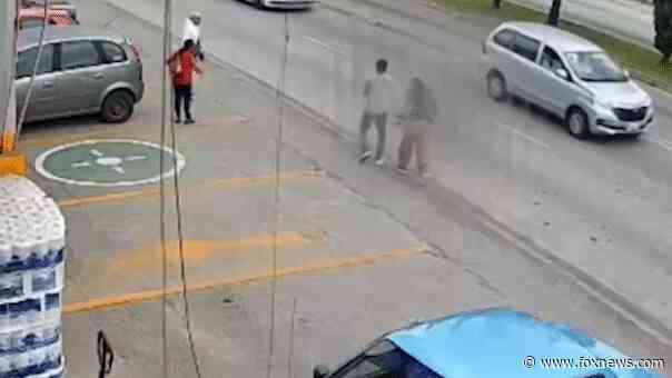 Video captures grocery store manager's daring rescue of toddler who ran into oncoming traffic