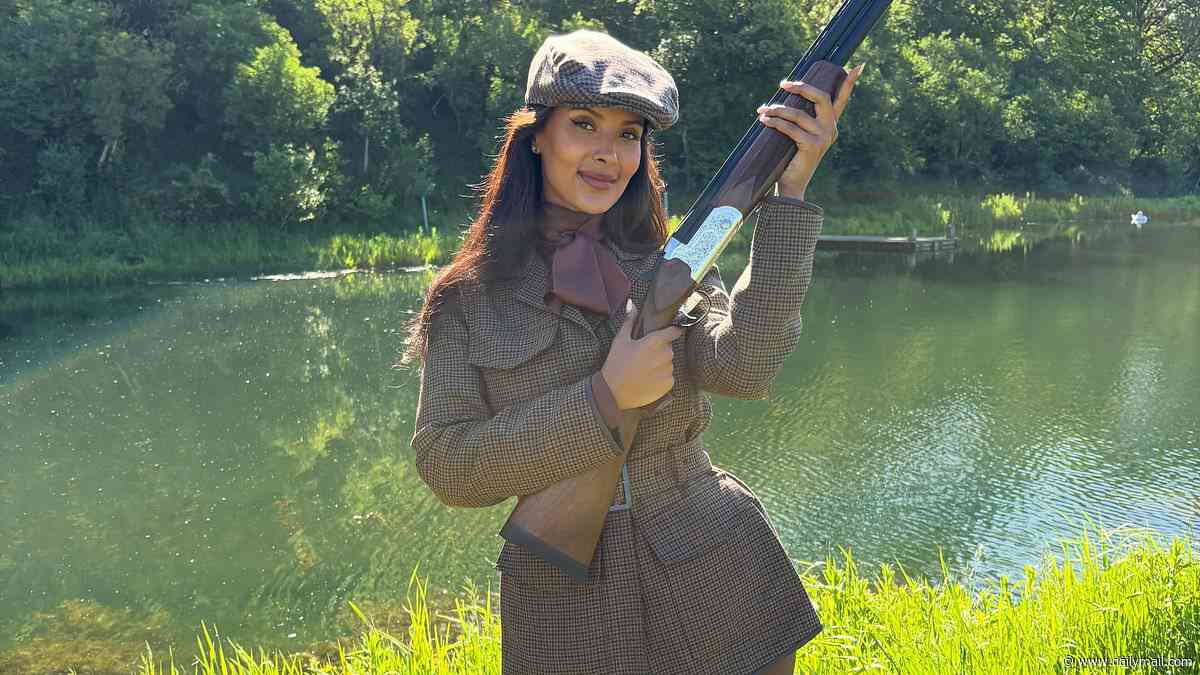 Maya Jama brandishes a gun as she strikes a pose with her 'beautiful' The Gentlemen co-stars in fun BTS snaps to mark the show scoring number one spot on Netflix