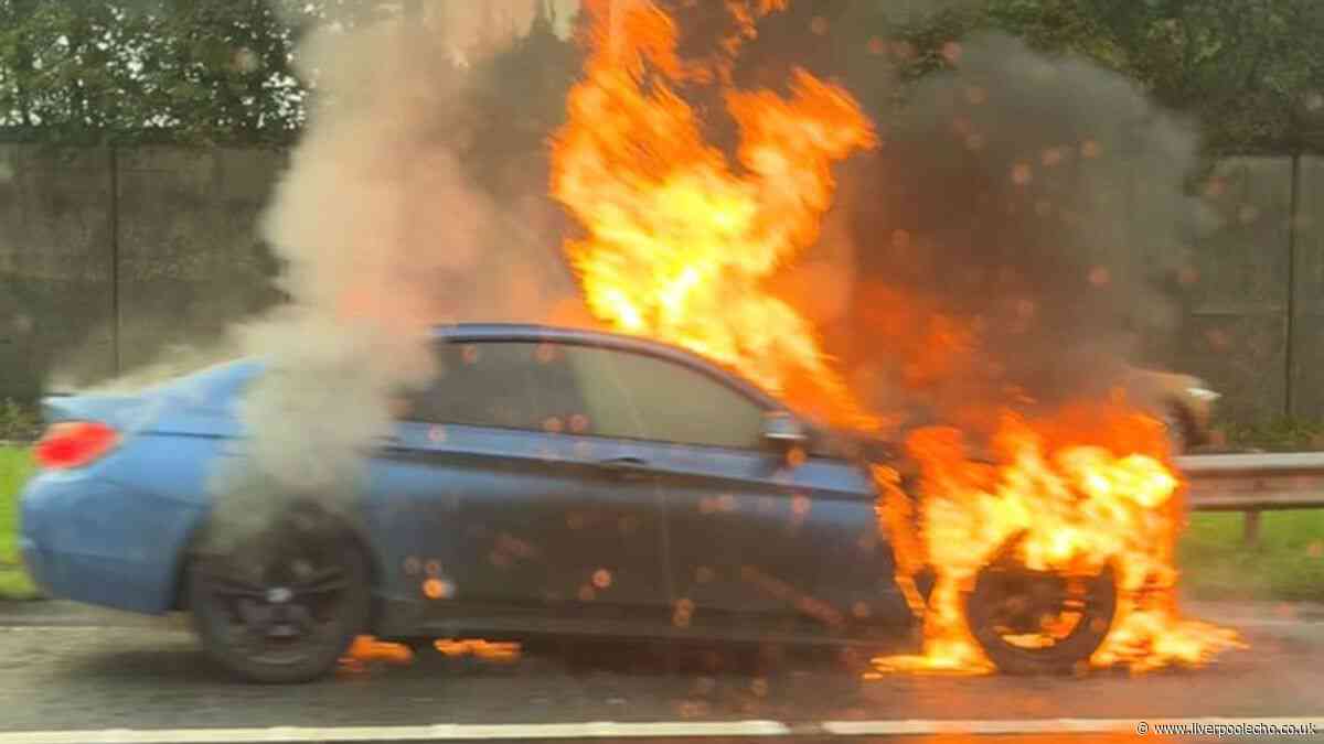 BMW bursts into flames on M62