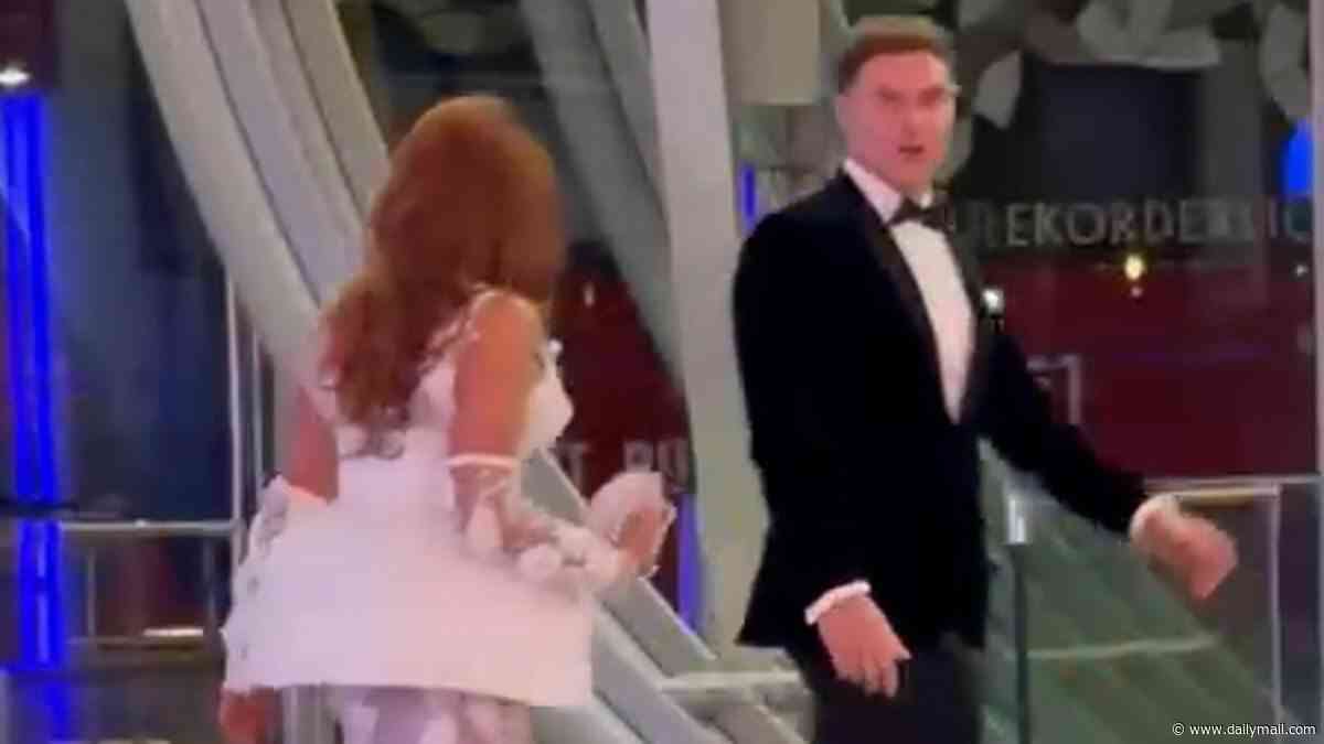 Charlotte Dawson and fiancé Matt Sarsfield engage in a tense discussion as he walks away from her in heated moment after the NTAs - nine months on from their split