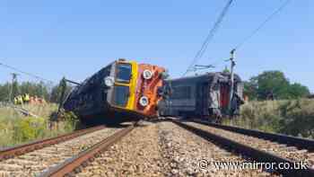 Train derails after crashing into truck in Poland with at least 20 casualties