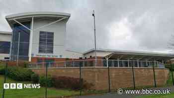 Police sniffer dogs search high school after 'bomb threat'