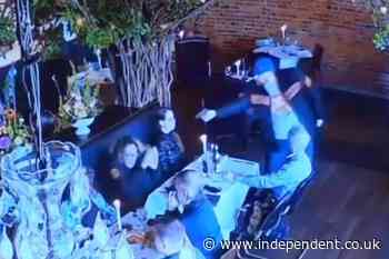 Moment man tries to fire point-blank at his ex in a restaurant - but is stopped by the gun’s safety and a daring waiter