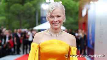 Pamela Anderson debuts dramatic new pincurl hairstyle as she sweeps onto the red carpet in dramatic golden gown for screening of A Place To Be