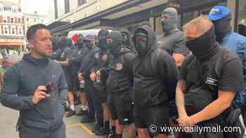 Balaclava-clad anti-migrant activists led by convicted criminal 'Danny Tommo' stage latest protest outside Daily Mail office