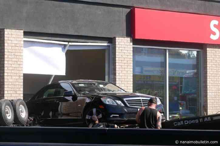 1 person taken to hospital after vehicle crashes through wall of Parksville bank