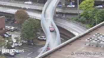 Car drives on pedestrian bridge over M8 in Glasgow