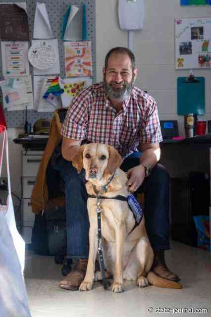Honett finds new career teaching with service dog at his side