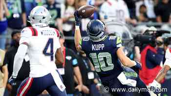 Hollywood star stuns fans as he steps behind the camera to become a photographer for NFL opener in Seattle