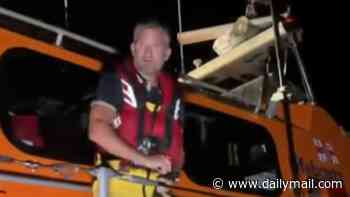 RNLI volunteer says 'I'm not a traitor' after being wrongly named as helping small boat migrants ashore - as protesters demonstrate outside charity's HQ