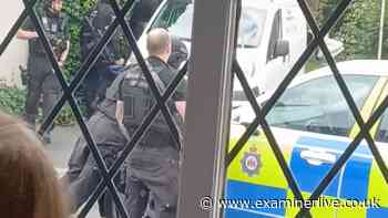 Armed police swoop outside Huddersfield pub as man 'handcuffed'