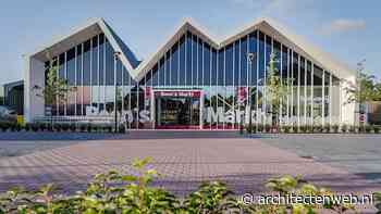 Nieuwbouw supermarkt met speelse puntdaken