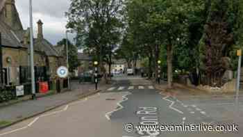 Car hits wall near Huddersfield school with roads shut and air ambulance landing