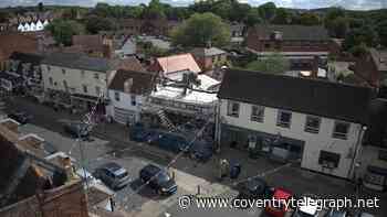 Council set to bid for fire-damaged pub at auction despite 'black hole' warning
