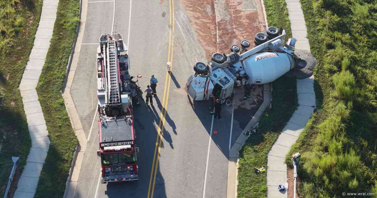 Driver injured after mixer truck flips near Holly Springs neighborhood
