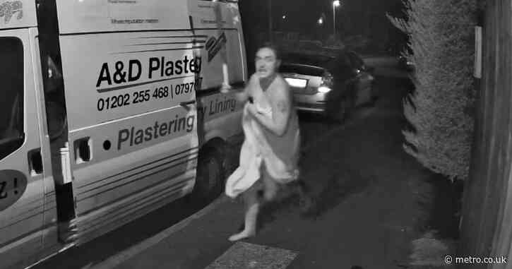 Moment woman wearing only bath towel armed with baseball bat chases off car thief