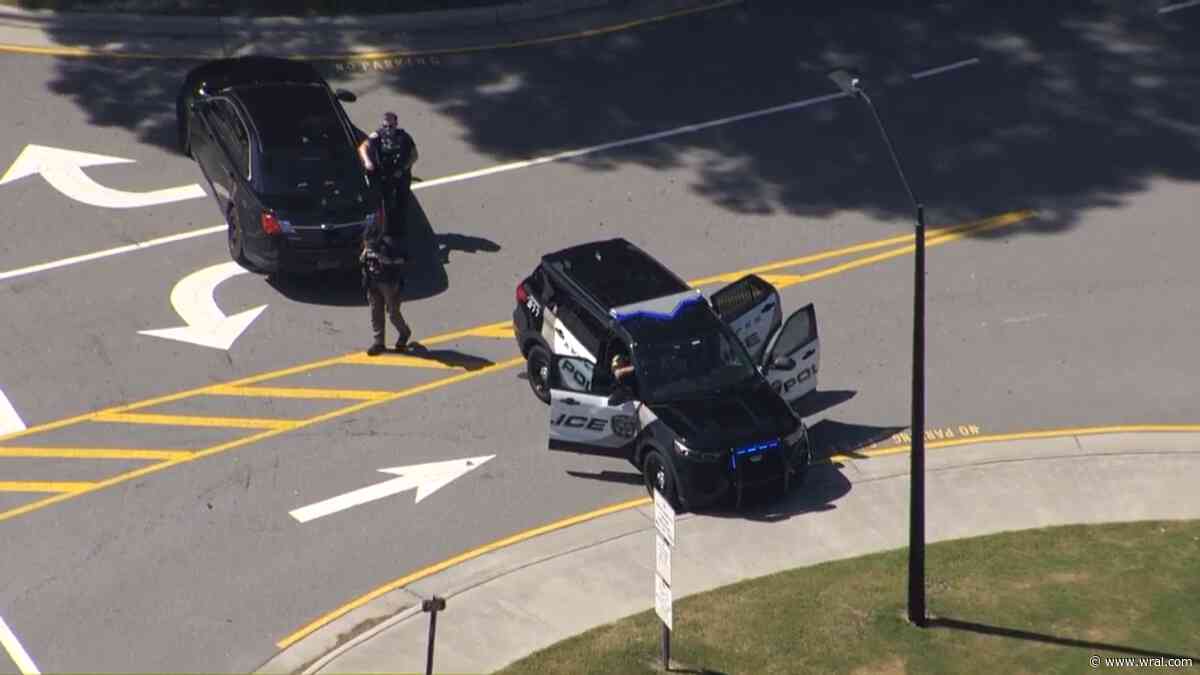 Police presence at Apex High School; school placed on hold