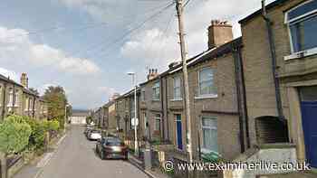 Police swarm Huddersfield home in 'firearm and drugs' probe as one arrested
