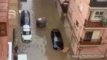 Flash floods in Spanish holiday hotspots kill woman, 67, as torrential rain turns roads into rivers