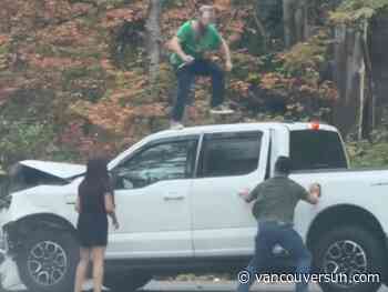 Video: Man escapes knife-wielding assailant by hanging off moving Tesla