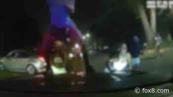 Watch: Woman dances on police car during huge street party in Cleveland