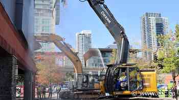 Surrey mayor first to tear into building, starting demolition for new 10,000-seat arena