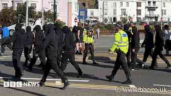 Use all powers necessary on anti-migrant protests, home secretary tells police
