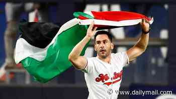 Palestinian flag-waving fan storms the field at Yankee Stadium before being dragged off to 'USA' chants during 9/11 anniversary Subway Series