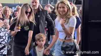Kyle Sandilands' wife Tegan Kynaston flashes her toned abs as she steps out with four-year-old son Otto at the radio star's meet-and-greet in Strathfield