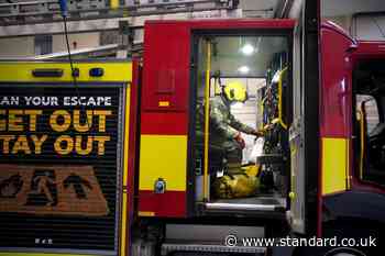 Woman and child flee burning flat as 70 firefighters tackle blaze in Poplar tower block