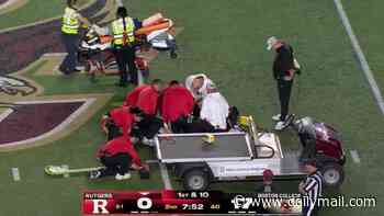 College football player left motionless by awkward hit is rushed to Boston hospital in frightening scene