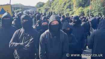 Man becomes first arrested for 'concealing his identity' hours after face covering ban