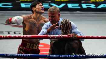 Garcia backs up talk, TKO's Benn in second round to retain WBC title