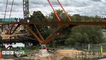Bridge structure lifted into place over River Avon