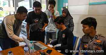 Search underway for 130 people after Indonesian passenger ship overturns