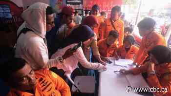 Search underway for about 130 people after Indonesian ferry overturns