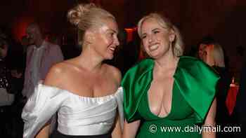Rebel Wilson busts out in revealing emerald gown as she enjoys date night with wife Ramona Agruma at Golden Globes party in Toronto