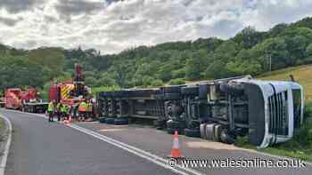 Road closed for hours as massive lorry overturns
