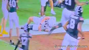 College football player has his arm snapped in horrific tackle after trying to stop touchdown and getting kicked in the head