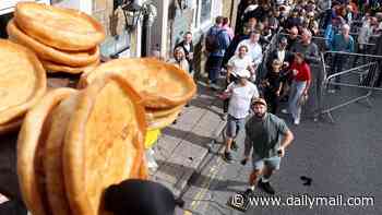 Hundreds of revellers flock to market town to watch annual World Black Pudding Throwing Championships