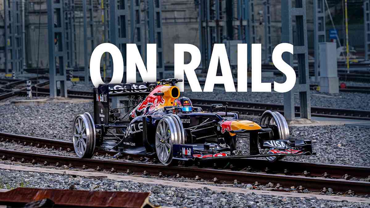 Driving a Formula 1 Car on Train Tracks