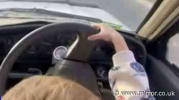 Boy, 3, seen behind car wheel in 'deeply concerning' video as man charged with reckless driving