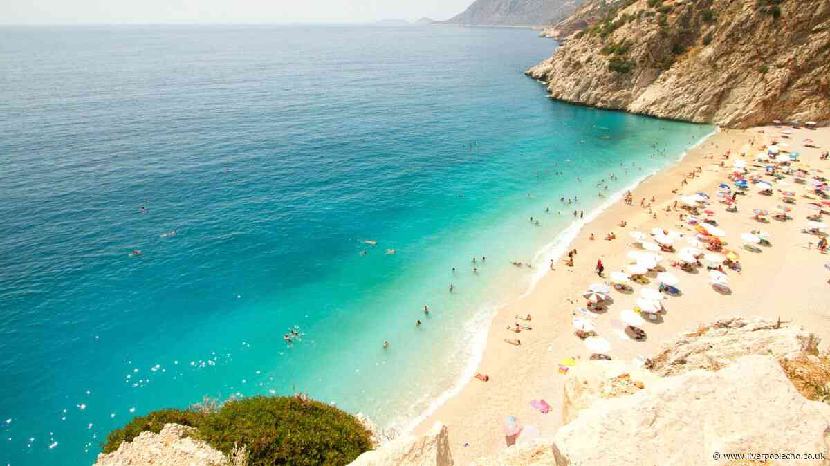 European city with beautiful sandy beaches and charming old town is 31C in September